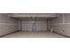 Spacious two-car garage with ample room for parking and storage at 164 Weldon Rd, Mcdonough, GA 30253
