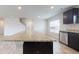 Spacious kitchen island with granite countertop and dark wood cabinets at 164 Weldon Rd, Mcdonough, GA 30253