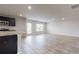 Open-concept living space featuring a modern kitchen with stainless steel appliances and a large island at 164 Weldon Rd, Mcdonough, GA 30253