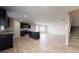 Open-concept living space featuring a modern kitchen with stainless steel appliances and a large island at 164 Weldon Rd, Mcdonough, GA 30253