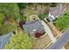 A beautiful home features lush landscaping, a curved driveway, and a well-maintained yard at 204 Maple Creek Chase, Woodstock, GA 30188