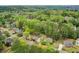 Lovely home nestled among mature trees and lush landscaping in a serene setting at 204 Maple Creek Chase, Woodstock, GA 30188