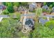 An aerial view reveals the home's backyard and a patio area perfect for outdoor enjoyment at 204 Maple Creek Chase, Woodstock, GA 30188