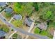 An aerial shot shows the property's location on a tree-lined street in a residential neighborhood at 204 Maple Creek Chase, Woodstock, GA 30188