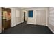 Finished basement with carpet, wainscoting, storage closet, and accent wall at 204 Maple Creek Chase, Woodstock, GA 30188