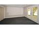 Finished basement with carpet, wainscoting and walkout to backyard through double doors at 204 Maple Creek Chase, Woodstock, GA 30188