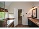 Bright bathroom features a soaking tub, granite countertops, and a window with natural light at 204 Maple Creek Chase, Woodstock, GA 30188