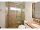 Modern bathroom featuring a glass enclosed shower with neutral toned tile and granite topped vanity at 204 Maple Creek Chase, Woodstock, GA 30188