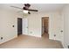 This bedroom offers neutral colors, a ceiling fan, and access to an ensuite bathroom at 204 Maple Creek Chase, Woodstock, GA 30188