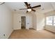 Bedroom featuring a ceiling fan, natural light, and views into another room at 204 Maple Creek Chase, Woodstock, GA 30188