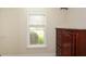 Bedroom featuring a window with wooden blinds and a wooden dresser at 204 Maple Creek Chase, Woodstock, GA 30188