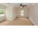 Spacious bedroom with large windows, neutral carpeting, and a ceiling fan at 204 Maple Creek Chase, Woodstock, GA 30188