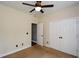 Neutral bedroom with carpet, ceiling fan, closet, and two doors at 204 Maple Creek Chase, Woodstock, GA 30188