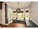 Cozy breakfast nook with built-in bench seating, natural light, and access to the outdoor deck at 204 Maple Creek Chase, Woodstock, GA 30188