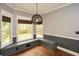Charming breakfast nook with built-in seating and large windows offering beautiful backyard views at 204 Maple Creek Chase, Woodstock, GA 30188