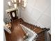 Elegant foyer with hardwood floors, a staircase with iron railings, and a clear view of the front door at 204 Maple Creek Chase, Woodstock, GA 30188