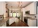 Bright and open kitchen with granite countertops, stainless steel appliances, and a breakfast nook at 204 Maple Creek Chase, Woodstock, GA 30188