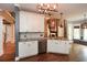 Open kitchen featuring granite counters, stainless steel appliances, and seamless flow into the living spaces at 204 Maple Creek Chase, Woodstock, GA 30188