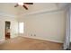 Bright main bedroom with a ceiling fan, walk-in closet, and ensuite bathroom at 204 Maple Creek Chase, Woodstock, GA 30188