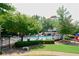 Relaxing community pool area with comfortable seating and a peaceful atmosphere at 204 Maple Creek Chase, Woodstock, GA 30188
