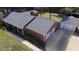 Aerial shot of home, detached garage, and well-maintained yard and driveway at 2533 Whispering Pines Dr, Grayson, GA 30017