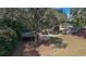 The backyard features mature trees, greenery and a covered parking area at 2533 Whispering Pines Dr, Grayson, GA 30017