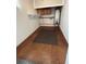 Basement storage area featuring a water heater, shelving, and concrete flooring at 2533 Whispering Pines Dr, Grayson, GA 30017