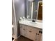 Bathroom featuring single sink vanity, mirror, and adjacent toilet at 2533 Whispering Pines Dr, Grayson, GA 30017