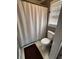 Bathroom with shower featuring a classic white shower curtain for added privacy at 2533 Whispering Pines Dr, Grayson, GA 30017