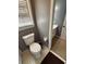 Well-lit bathroom featuring a toilet and a glimpse into the vanity area at 2533 Whispering Pines Dr, Grayson, GA 30017