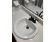 Bright bathroom sink with sleek black hardware and a modern countertop at 2533 Whispering Pines Dr, Grayson, GA 30017