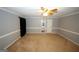 Spacious bedroom featuring neutral paint, a ceiling fan, and an attached bathroom at 2533 Whispering Pines Dr, Grayson, GA 30017