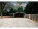 Functional carport providing sheltered parking and additional storage solutions at 2533 Whispering Pines Dr, Grayson, GA 30017