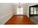 Elegant dining room with hardwood floors, chair railing and chandelier at 2533 Whispering Pines Dr, Grayson, GA 30017