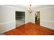 Dining room showcasing hardwood floors and an elegant chandelier at 2533 Whispering Pines Dr, Grayson, GA 30017