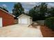 Spacious driveway and detached garage offering convenience and ample parking at 2533 Whispering Pines Dr, Grayson, GA 30017
