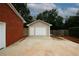 Detached garage with a convenient driveway, blending functionality with classic style at 2533 Whispering Pines Dr, Grayson, GA 30017