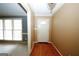 Bright foyer with hardwood floors, white door, and natural light streaming through the window at 2533 Whispering Pines Dr, Grayson, GA 30017