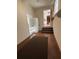 Hallway with storage cabinets leading to the staircase at 2533 Whispering Pines Dr, Grayson, GA 30017