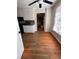 Open eat-in kitchen with hardwood floors and views of the backyard and living room at 2533 Whispering Pines Dr, Grayson, GA 30017