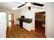 Kitchen with white cabinets and stainless steel appliances leading to the dining and living room at 2533 Whispering Pines Dr, Grayson, GA 30017