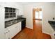 Kitchen with stainless steel sink and view into dining room at 2533 Whispering Pines Dr, Grayson, GA 30017
