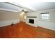 Inviting living room featuring hardwood floors, a fireplace, and a ceiling fan at 2533 Whispering Pines Dr, Grayson, GA 30017