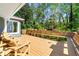 Enjoy outdoor living on the spacious wooden deck, perfect for entertaining or relaxing with wooded views at 3325 N Embry Cir, Atlanta, GA 30341