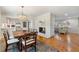 Elegant dining room with hardwood floors, chandelier lighting, and a cozy fireplace at 3325 N Embry Cir, Atlanta, GA 30341