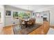 Sunlit dining area with a large window overlooking the backyard and modern kitchen access at 3325 N Embry Cir, Atlanta, GA 30341
