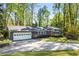 Beautiful single-story home with a well-manicured lawn and a driveway leading to a garage at 3325 N Embry Cir, Atlanta, GA 30341