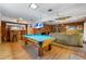 Spacious game room with a billiard table, bar, and seating area at 3325 N Embry Cir, Atlanta, GA 30341