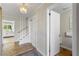Bright hallway with wood floors, white trim, and a staircase leading to the upper level at 3325 N Embry Cir, Atlanta, GA 30341