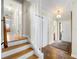Hallway with wooden floors, a staircase, and a view of the entry at 3325 N Embry Cir, Atlanta, GA 30341